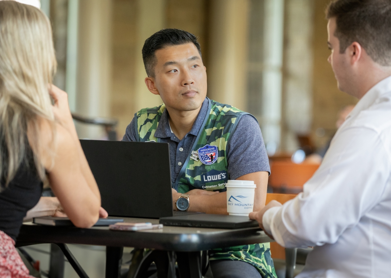 Military intern meeting with other Lowe's interns in the cafeteria