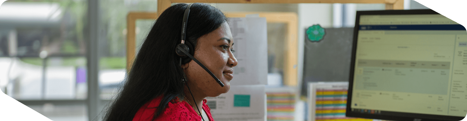 Lowe's associate taking a customer's call at her desk