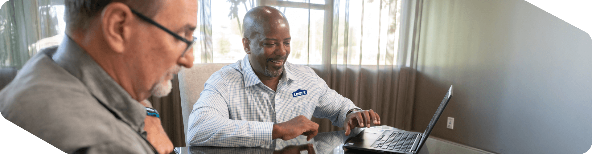Lowe's sales associate assisting a customer