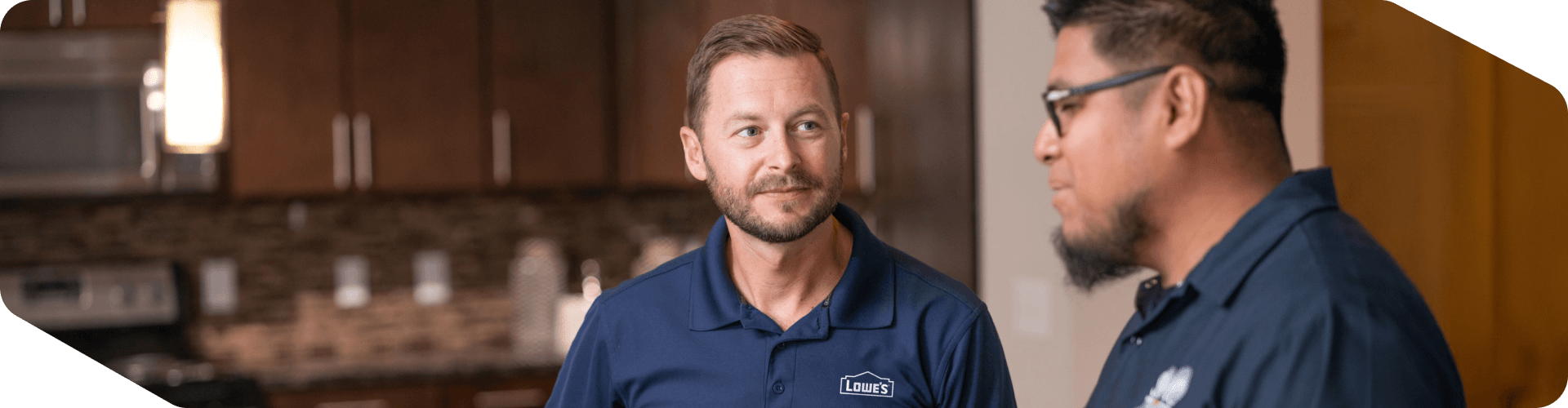 Lowe's associate speaking with a client