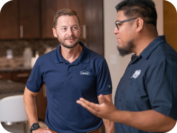 Lowe's associate speaking with a client