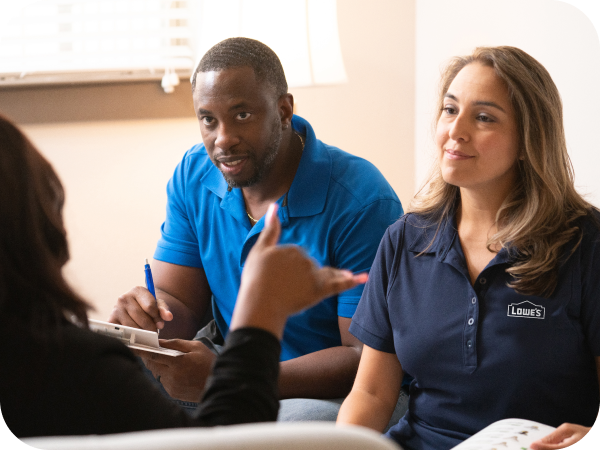Lowe's associate walking through the doors of a client's office