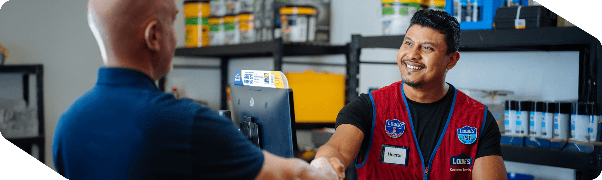 Lowe's bilingual associate assisting a customer with his purchase
