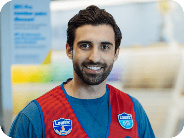 Bilingual Lowe's store associate working in the Paint department