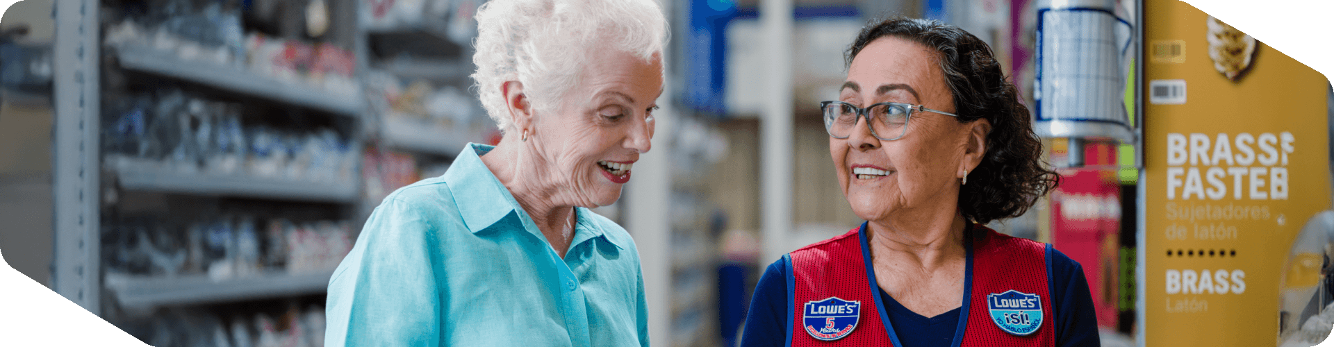 Lowe's store associate assisting a customer in the hardware