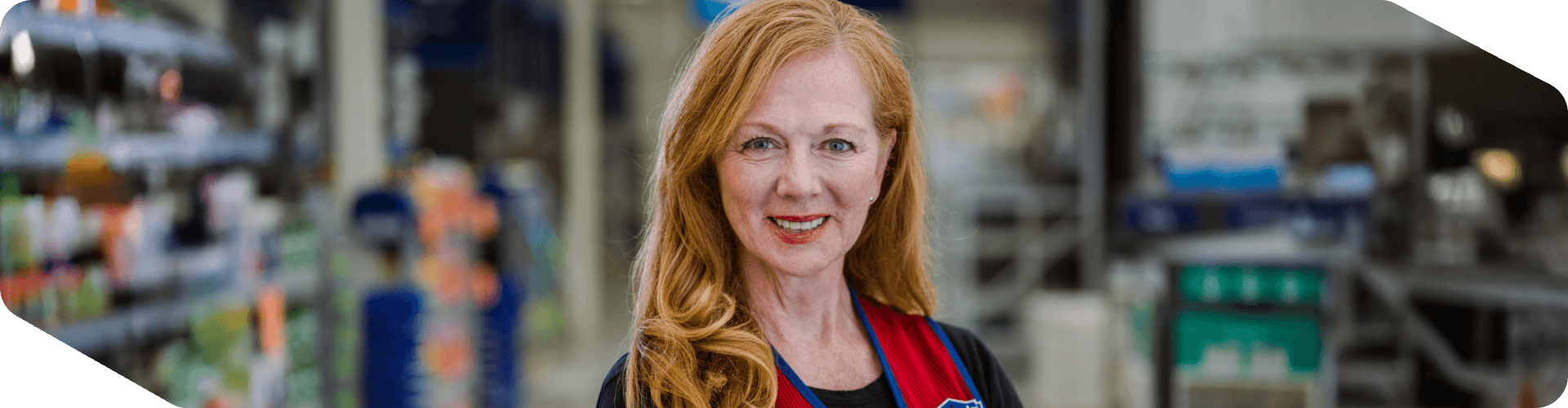 Lowe's store associate smiling confidently while working
