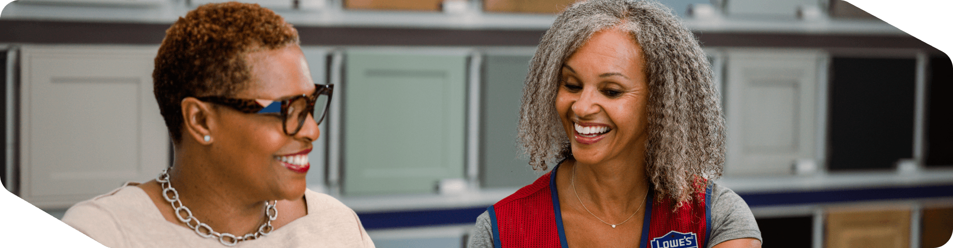 Lowe's Sales Specialist helping a customer with a cabinet order