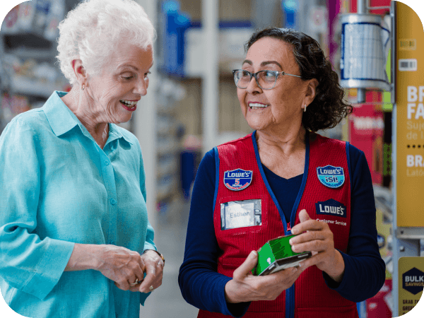 Lowe's store associate assisting a customer in the hardware