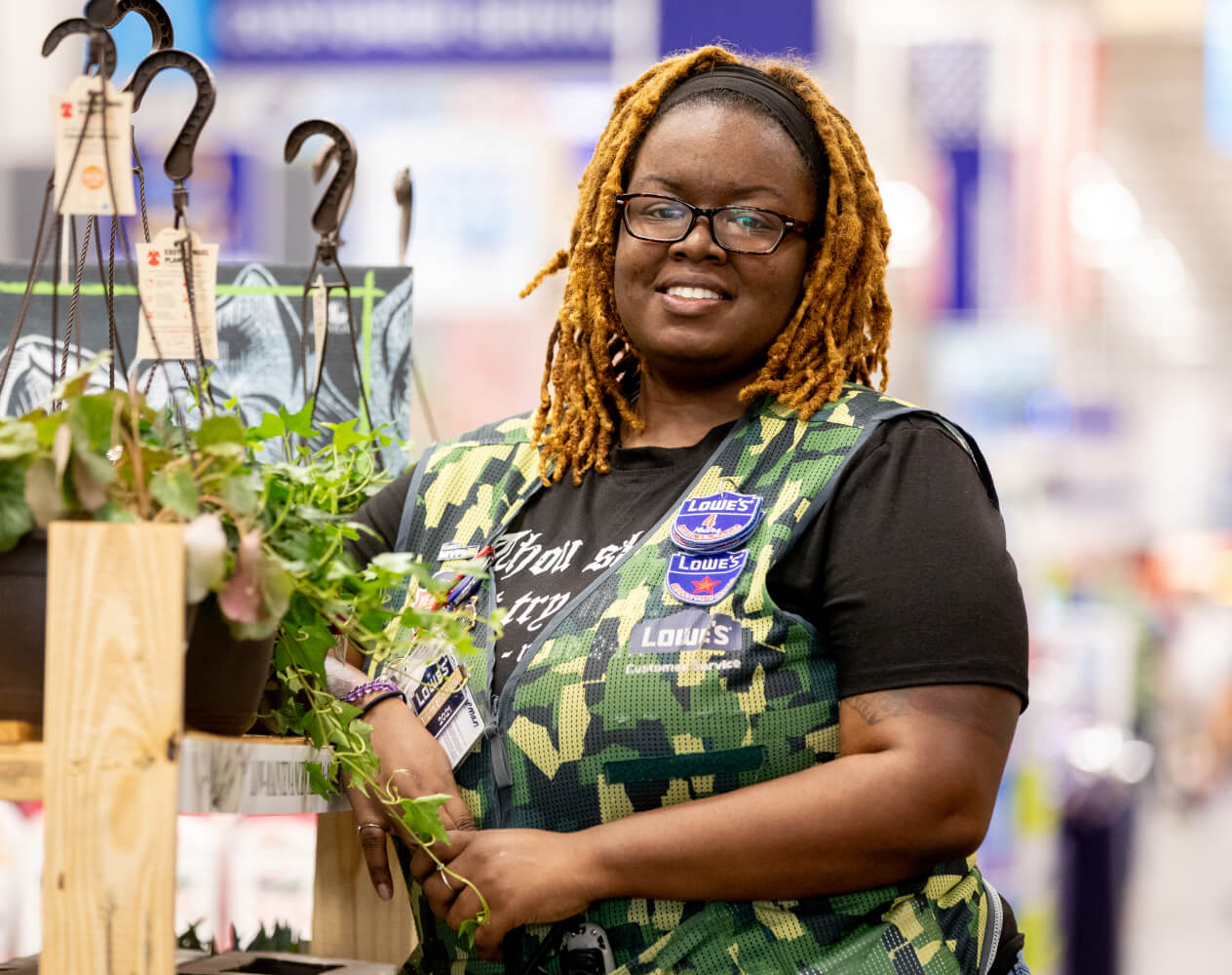 Store associate wearing a Lowe's military vest