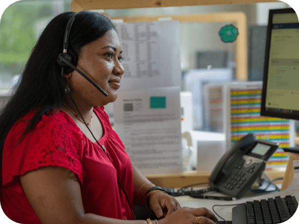 Supply Chain associate working in her office on a call