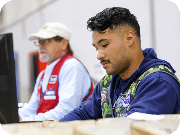 Supply Chain associates working at their computers in the distribution center