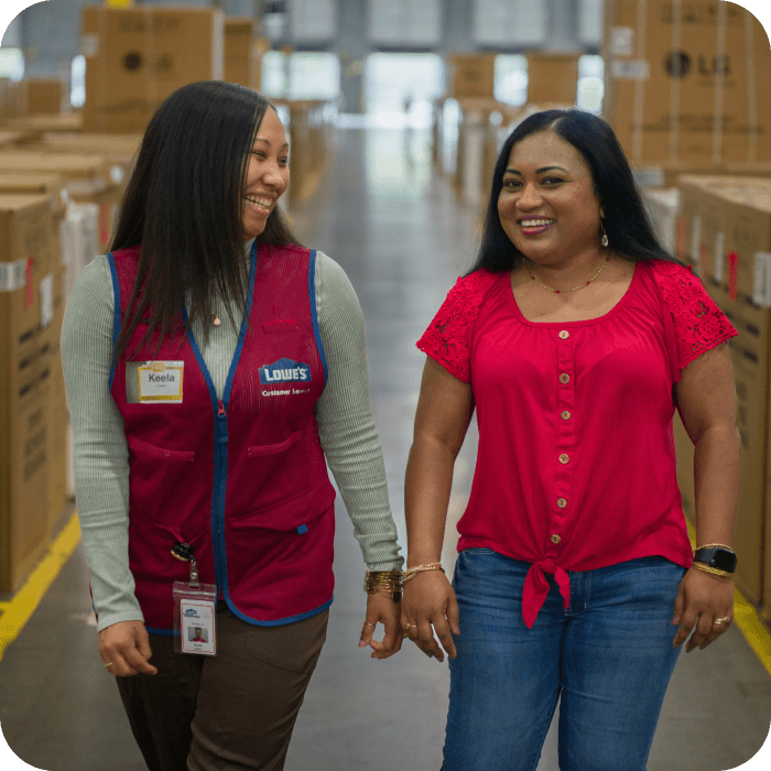 Supply Chain associates walking together in a warehouse