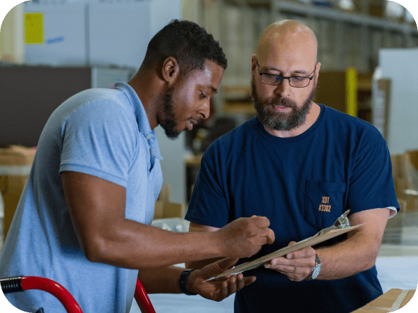 Supply Chain associate signing for a delivery