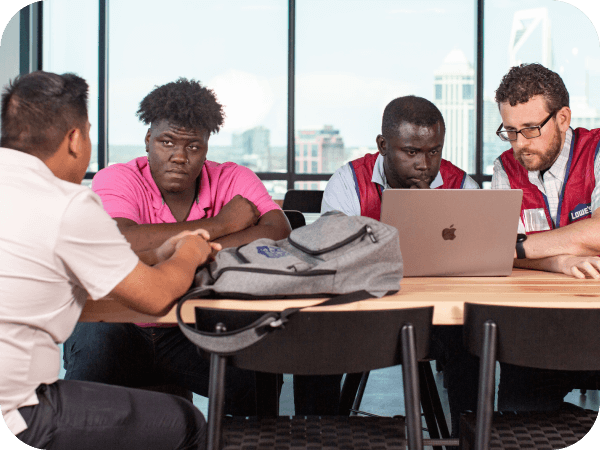 Group of male associates discussing work