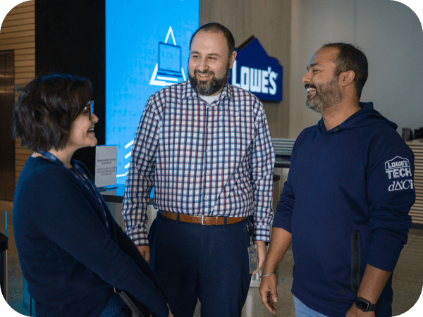 Group of Tech associates having a conversation in the Tech Hub