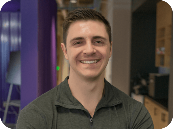 Lowe's Tech associate standing in an open workspace at the Tech Hub