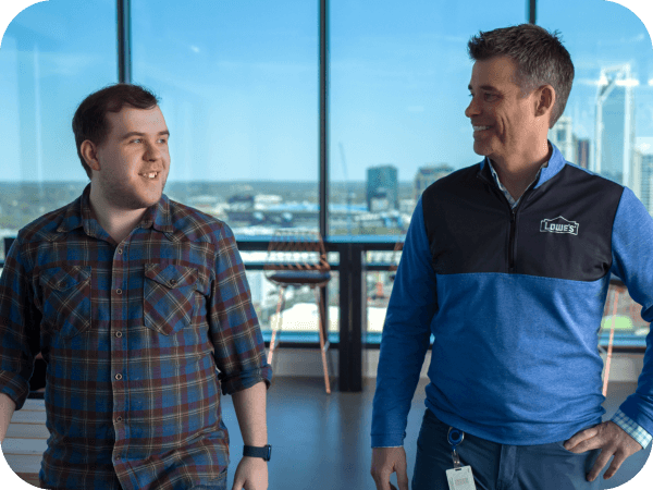 Two Tech associates walking through the Tech Hub
