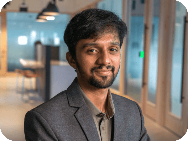 Lowe's Tech associate sitting in an open workspace at Corporate Headquarters