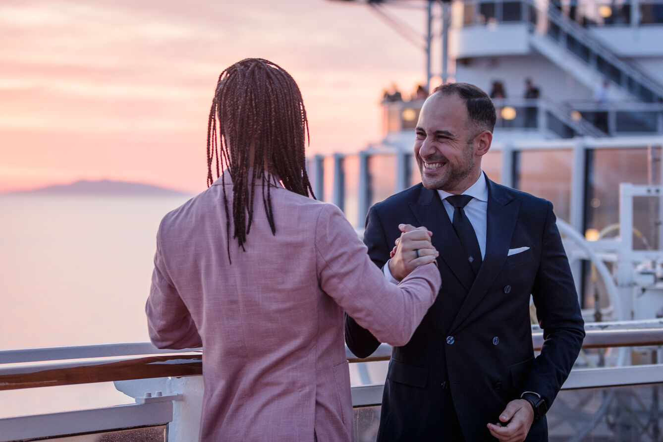 MSC Cruises crew on board shaking hands, symbolising respect, teamwork, and a sense of belonging