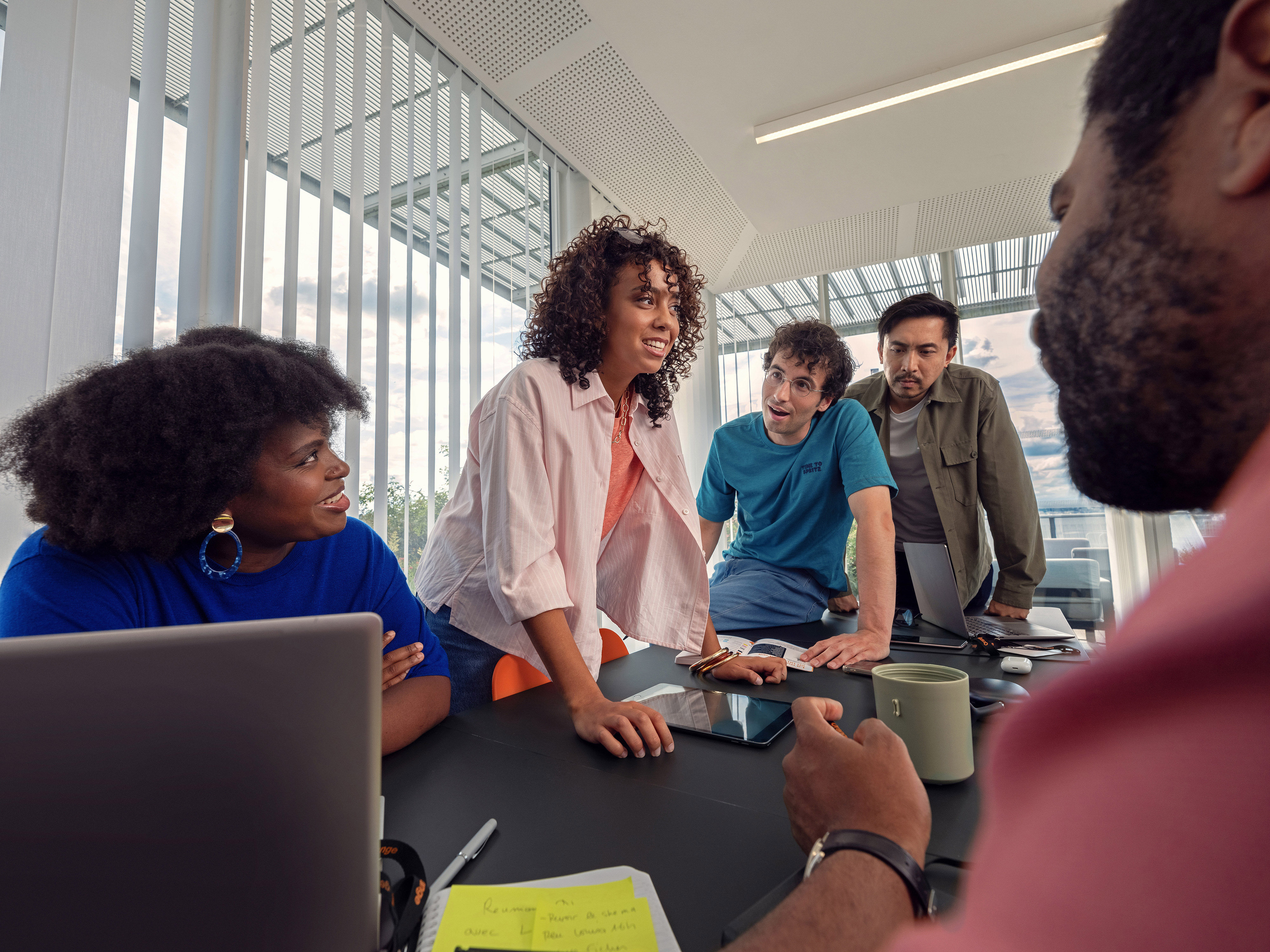 A convivial atmosphere during an Orange meeting.