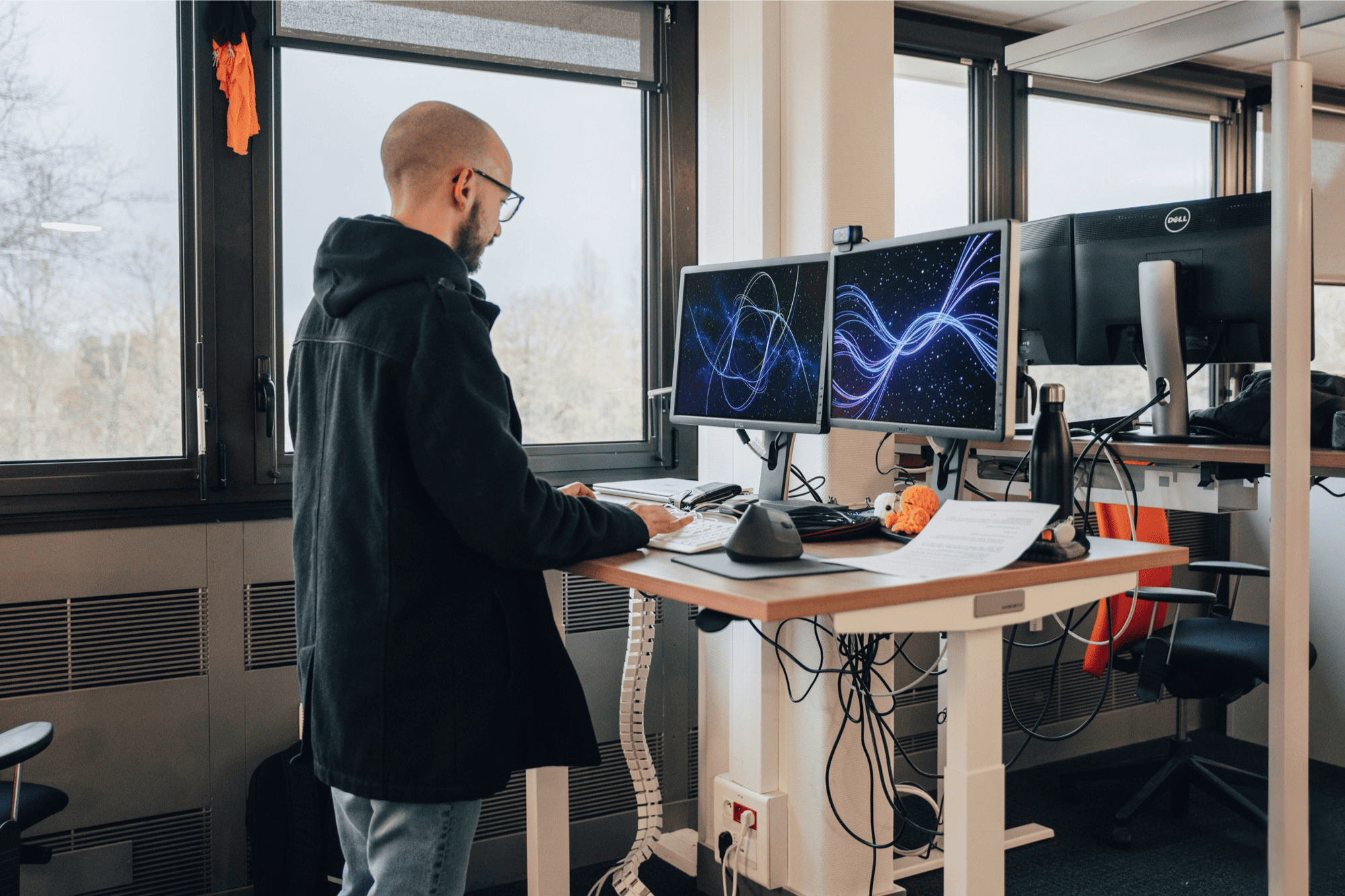 Supporting employee health with flexible work solutions, including ergonomic standing desks and dual-monitor setups in our Nantes office.