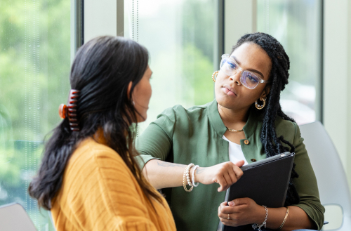 Female counselor listens to a vulnerable patient