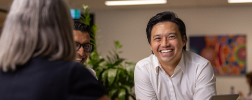 Young Asian man smiling at the camera