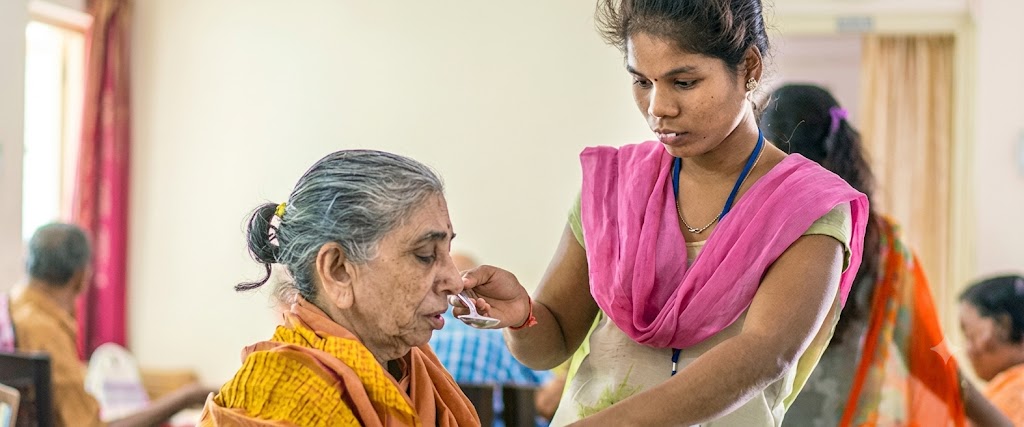Kshetra caregiver with a senior at home