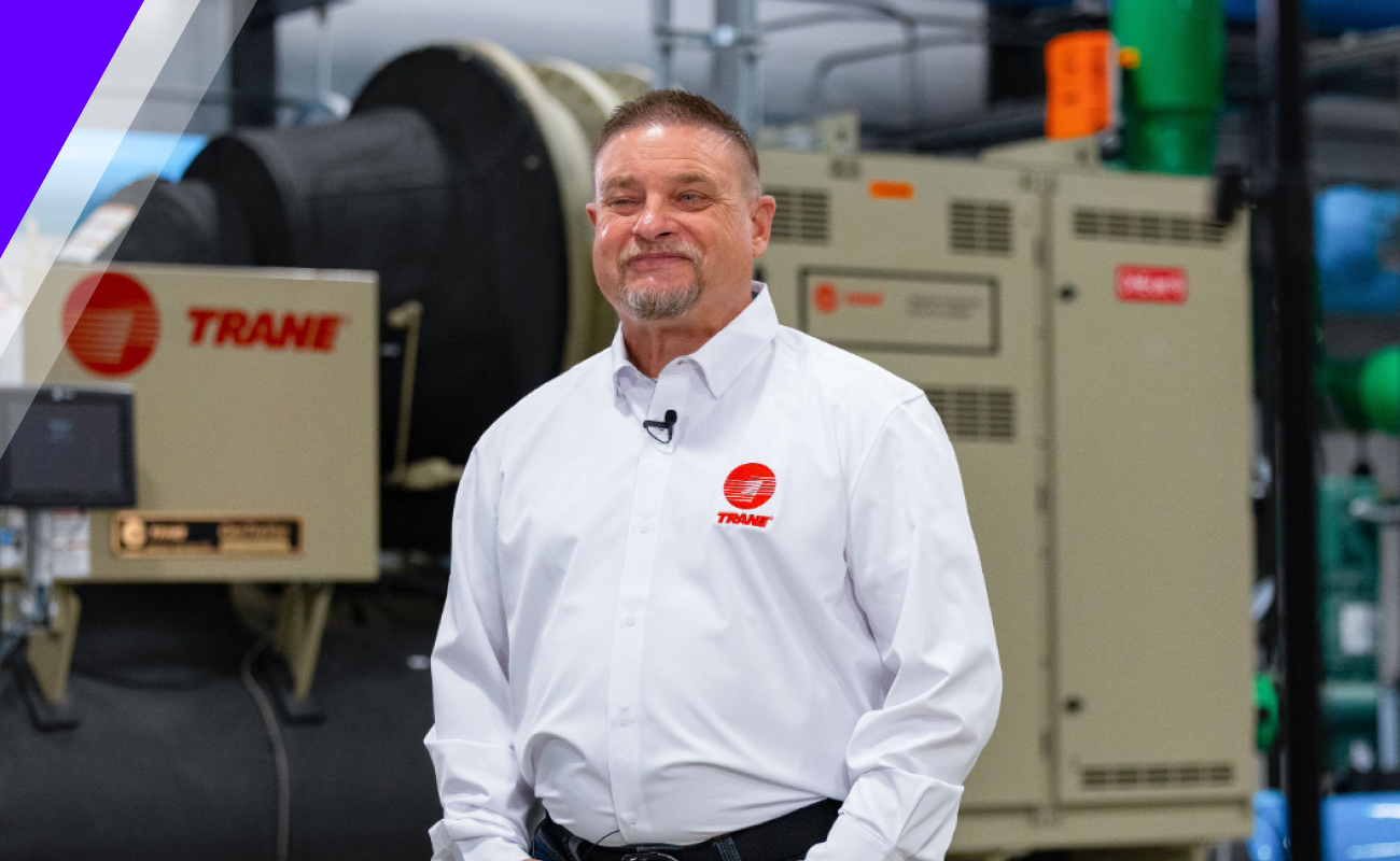 Robert standing with machinery behind him