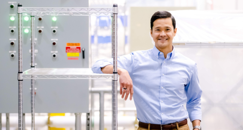 Dave, a quality assurance leader at BAE Systems, stands for a photo at a company facility in Boulder, CO.